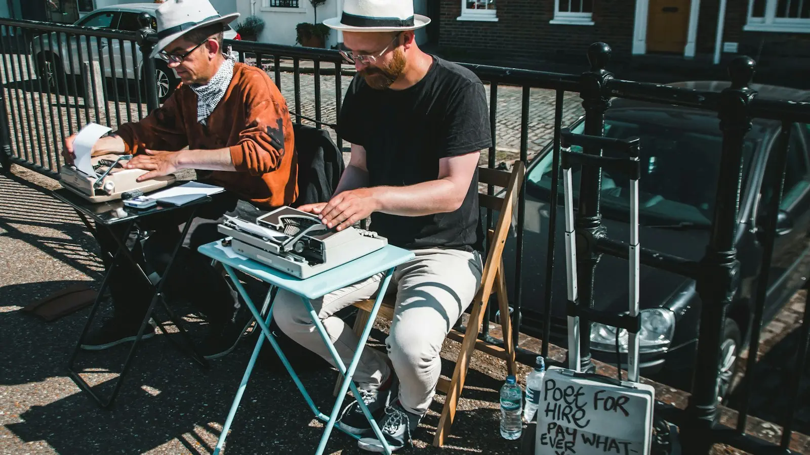 Two men typewriting