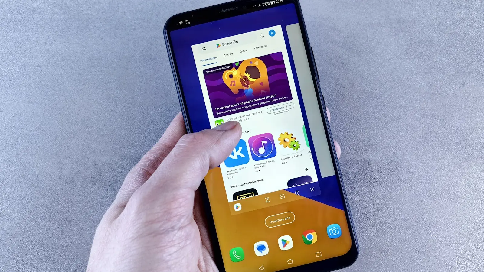 A person holding a cell phone in their hand